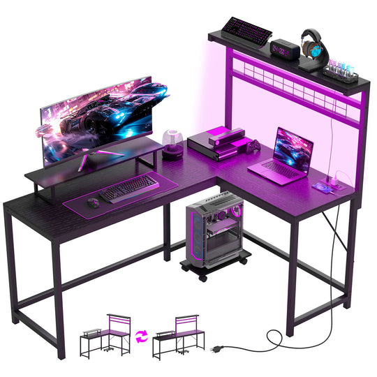 Gaming desk setup with computer monitor, keyboard, mouse, and laptop on a white background