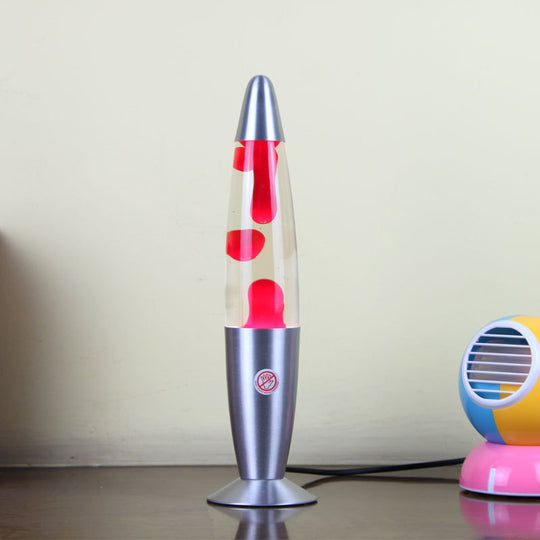 Lava lamp with red liquid and silver base on a plain background