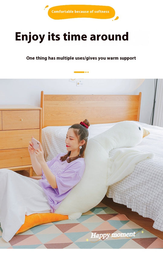 Woman using a large white pillow in a bedroom setting with text about comfort and support.