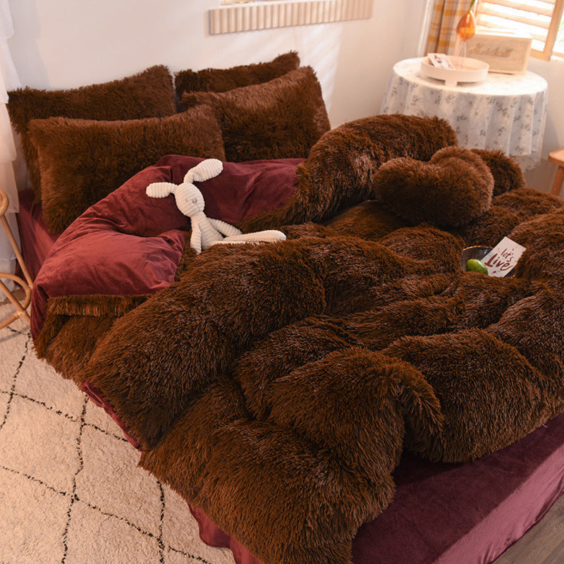 Brown fuzzy blanket draped over a bed with pillows and a stuffed animal in a cozy room.